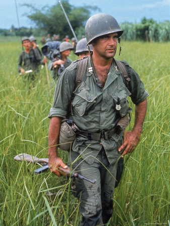 553909~US-Army-Captain-Robert-Bacon-Leading-a-Patrol-During-the-Early-Years-of-the-Vietnam-War-Posters